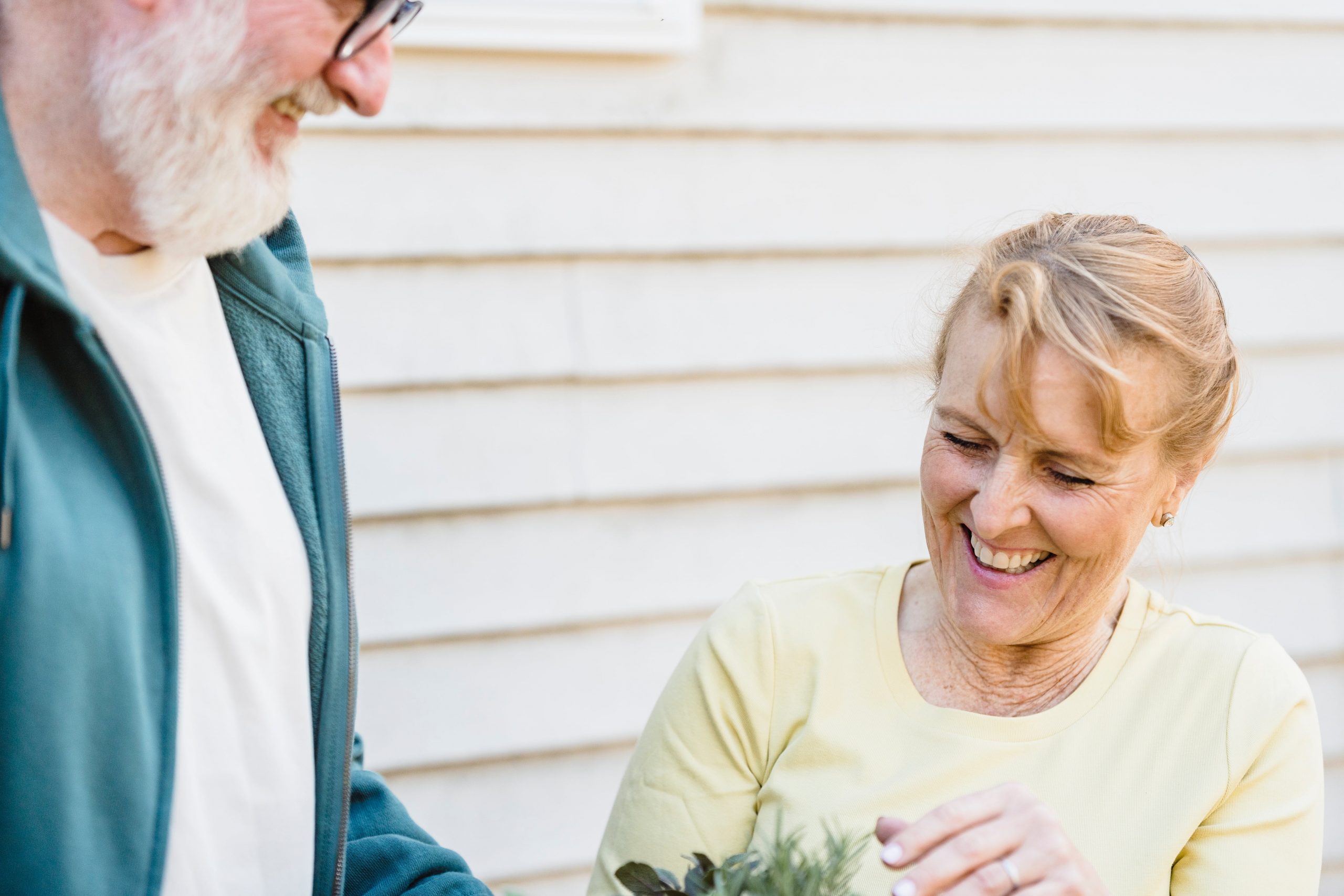 retired couple working on gardening project around their home